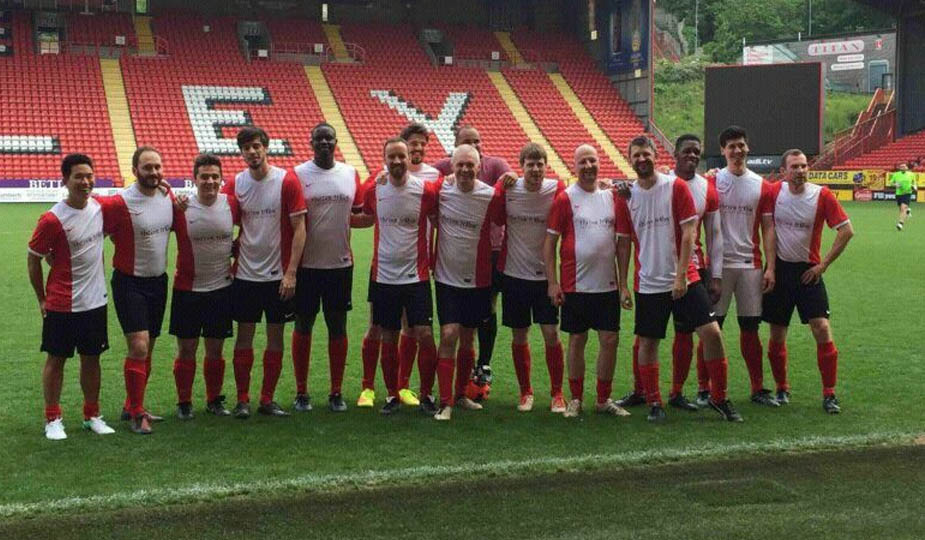 Healthy workplace football team match